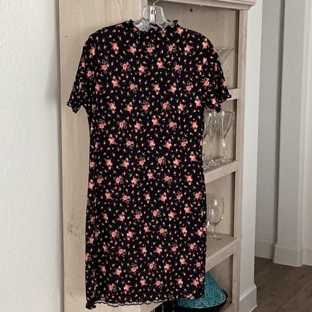 Cute shift dress has a lot of give 4% spandex.  New without tags, never worn.